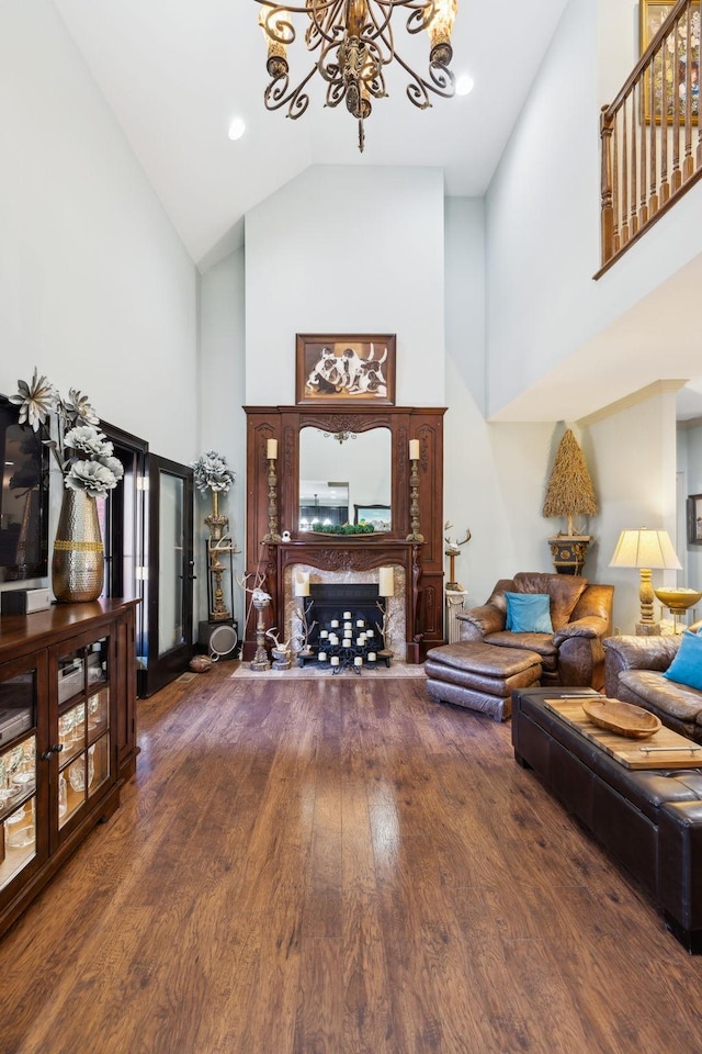 314 W 6th St Unit 7, Columbia, TN 38401 - living area with high vaulted ceiling, a chandelier, wood finished floors, and a fireplace