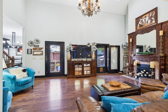 314 W 6th St Unit 7, Columbia, TN 38401 - living area featuring a chandelier, high vaulted ceiling, wood finished floors, stairs, and a premium fireplace
