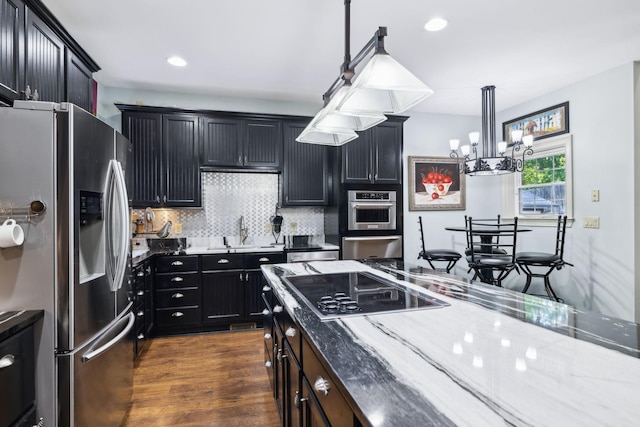 314 W 6th St Unit 7, Columbia, TN 38401 - kitchen with appliances with stainless steel finishes, a sink, light stone countertops, a chandelier, and dark cabinets