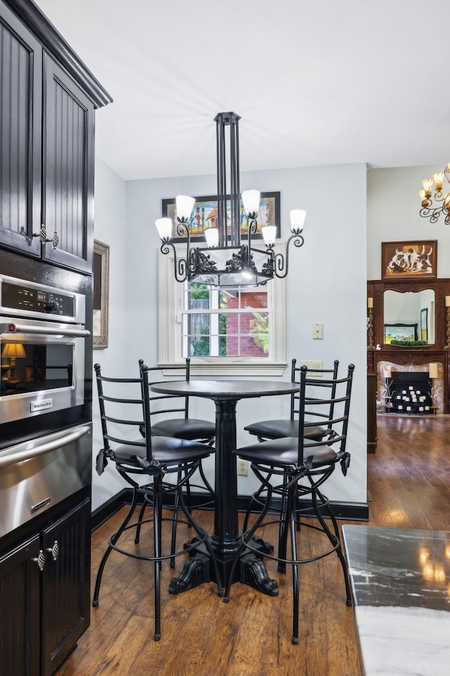 314 W 6th St Unit 7, Columbia, TN 38401 - dining space with a chandelier and dark wood-style floors