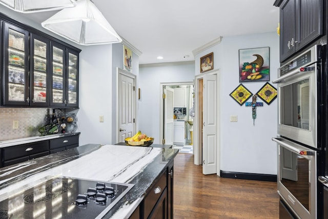 314 W 6th St Unit 7, Columbia, TN 38401 - kitchen featuring stainless steel double oven, black electric stovetop, dark wood-type flooring, tasteful backsplash, and stone counters
