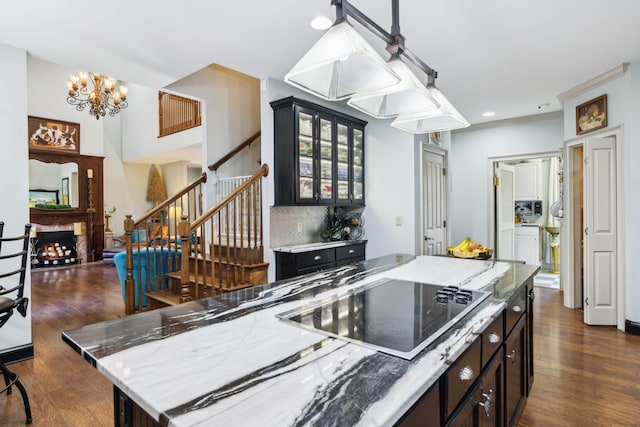 314 W 6th St Unit 7, Columbia, TN 38401 - kitchen with black electric cooktop, dark wood-style flooring, a chandelier, glass insert cabinets, and recessed lighting