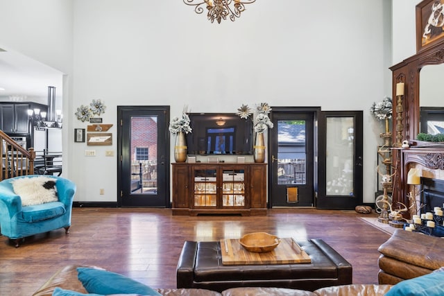 314 W 6th St Unit 7, Columbia, TN 38401 - living area featuring a high ceiling, a chandelier, wood finished floors, baseboards, and stairs
