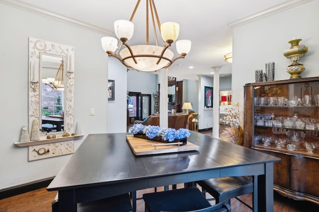 314 W 6th St Unit 7, Columbia, TN 38401 - dining space featuring a chandelier, decorative columns, crown molding, and wood finished floors