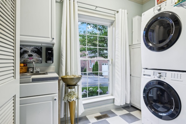 314 W 6th St Unit 7, Columbia, TN 38401 - washroom featuring stacked washer / drying machine, cabinet space, and tile patterned floors