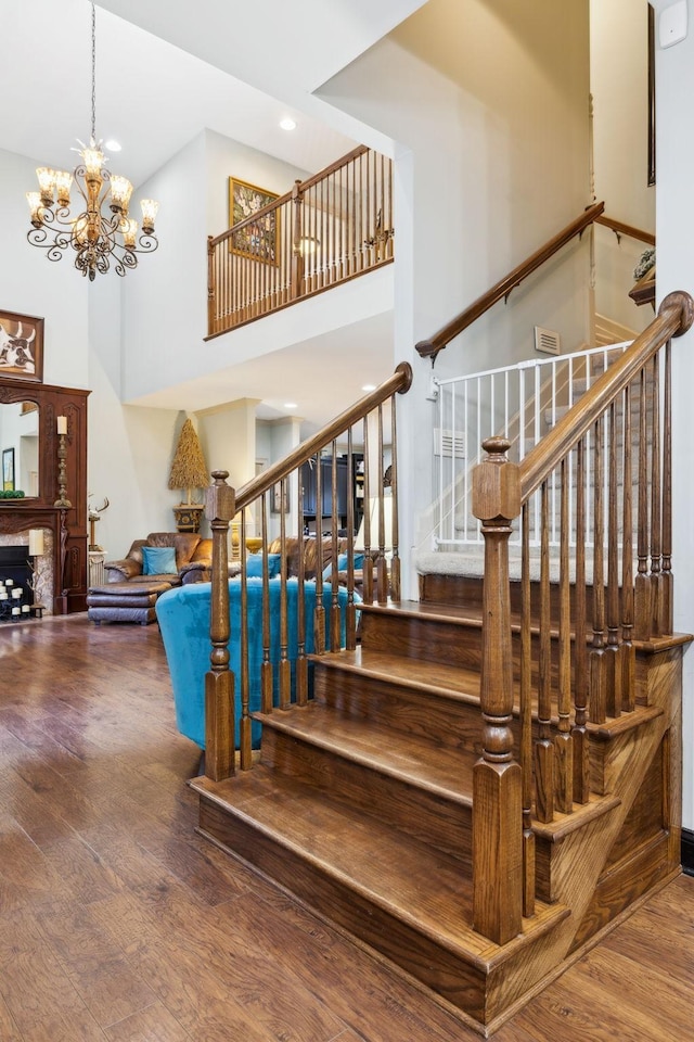 314 W 6th St Unit 7, Columbia, TN 38401 - stairs with wood finished floors, a high ceiling, a chandelier, and recessed lighting