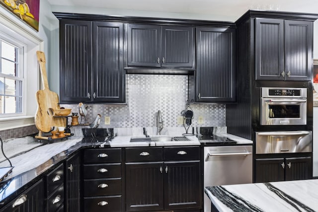 314 W 6th St Unit 7, Columbia, TN 38401 - kitchen featuring a warming drawer, a sink, backsplash, and stainless steel appliances