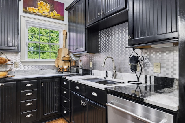 314 W 6th St Unit 7, Columbia, TN 38401 - kitchen featuring dishwasher, a sink, backsplash, dark cabinetry, and light stone counters