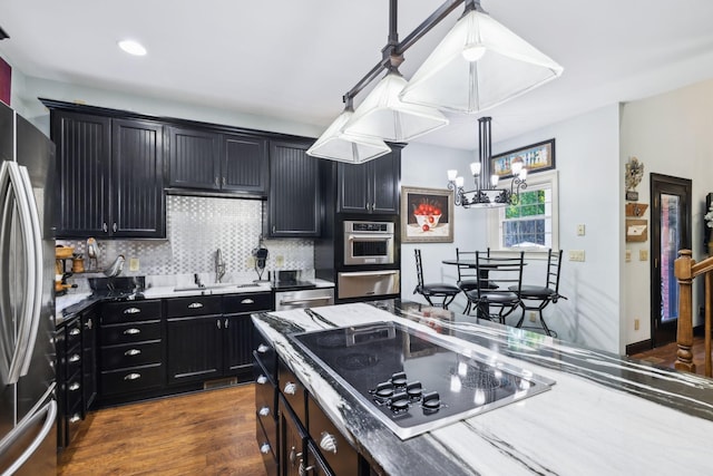 314 W 6th St Unit 7, Columbia, TN 38401 - kitchen with appliances with stainless steel finishes, dark cabinets, a chandelier, a warming drawer, and a sink