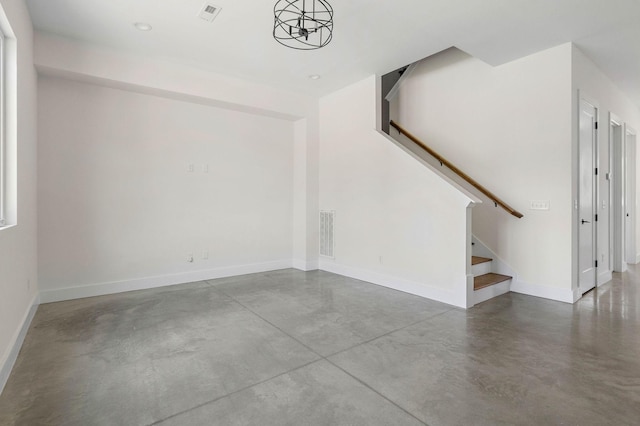 713B 32nd Ave N, Nashville, TN 37209 - unfurnished living room with concrete floors, stairs, and baseboards