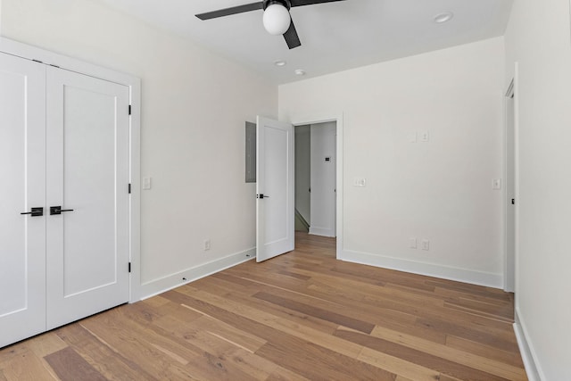 713B 32nd Ave N, Nashville, TN 37209 - unfurnished bedroom with baseboards, light wood finished floors, and a ceiling fan