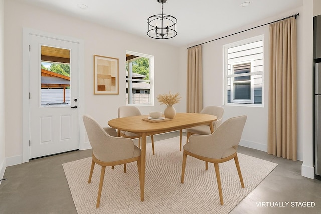 713B 32nd Ave N, Nashville, TN 37209 - dining area with concrete floors, a chandelier, and baseboards