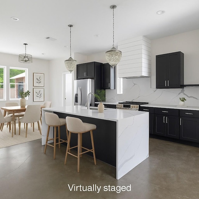 713B 32nd Ave N, Nashville, TN 37209 - kitchen featuring stainless steel appliances, wall chimney range hood, a sink, concrete floors, and recessed lighting