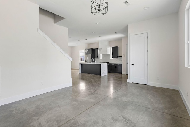 713B 32nd Ave N, Nashville, TN 37209 - unfurnished living room with finished concrete flooring and baseboards
