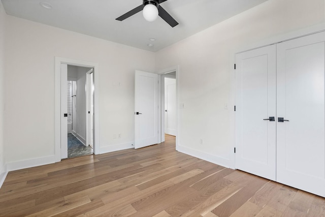 713B 32nd Ave N, Nashville, TN 37209 - unfurnished bedroom featuring light wood finished floors, baseboards, a closet, and ensuite bath
