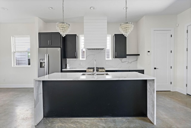 713B 32nd Ave N, Nashville, TN 37209 - kitchen with stainless steel fridge with ice dispenser, a chandelier, finished concrete floors, and recessed lighting