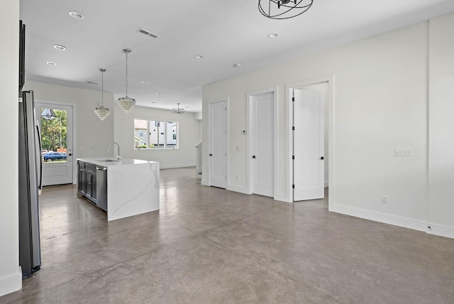 713B 32nd Ave N, Nashville, TN 37209 - unfurnished living room featuring concrete floors, baseboards, recessed lighting, a chandelier, and a sink