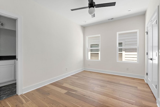 713B 32nd Ave N, Nashville, TN 37209 - unfurnished bedroom with light wood-type flooring, baseboards, and ceiling fan