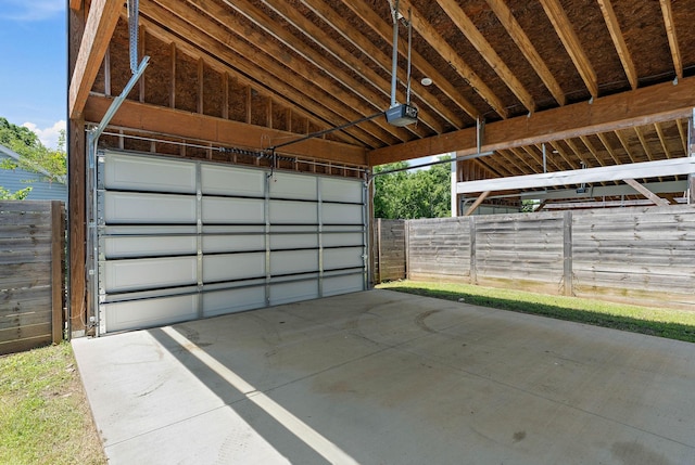 713B 32nd Ave N, Nashville, TN 37209 - garage featuring a garage door opener and driveway