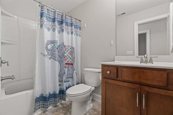 372 Old Stone Rd, Goodlettsville, TN 37072 - bathroom featuring vanity, toilet, and shower / bath combo with shower curtain