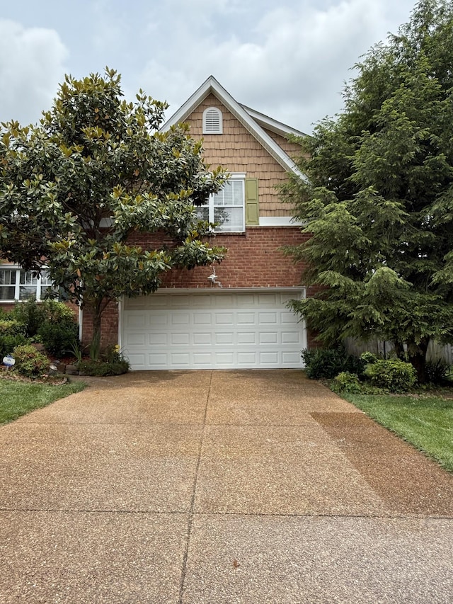1602 Zurich Dr, Spring Hill, TN 37174 - view of property exterior with concrete driveway, a garage, and brick siding