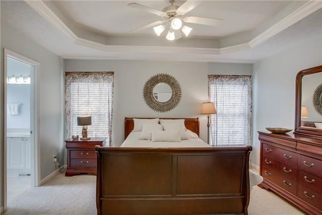 1602 Zurich Dr, Spring Hill, TN 37174 - bedroom featuring a tray ceiling, light carpet, multiple windows, and baseboards