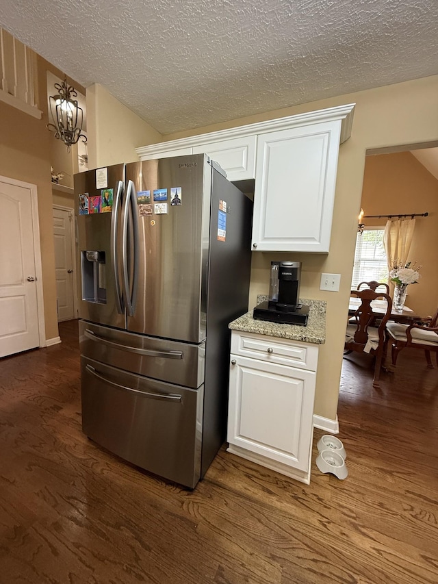 1602 Zurich Dr, Spring Hill, TN 37174 - kitchen with stainless steel refrigerator with ice dispenser, dark wood finished floors, white cabinets, a textured ceiling, and a chandelier