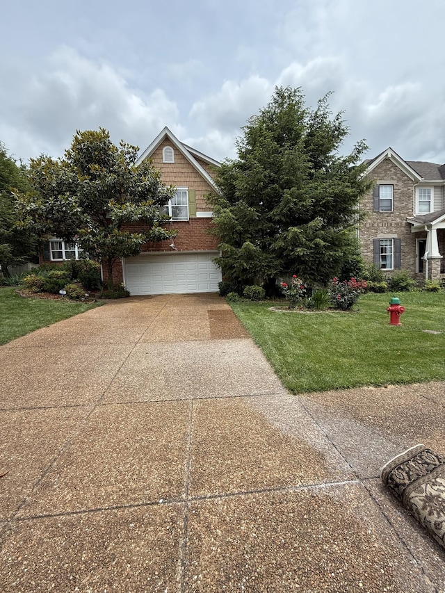 1602 Zurich Dr, Spring Hill, TN 37174 - view of front of property with concrete driveway, a front yard, and a garage