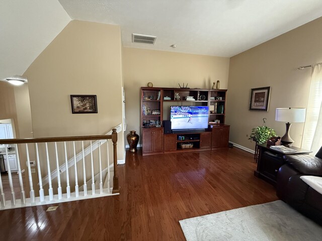 1602 Zurich Dr, Spring Hill, TN 37174 - living room with dark wood finished floors, lofted ceiling, and baseboards