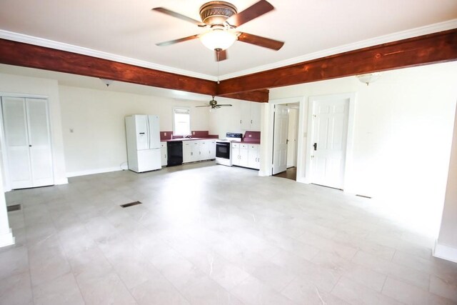 112 N Church St, Sparta, TN 38583 - garage with freestanding refrigerator, ceiling fan, baseboards, and a sink