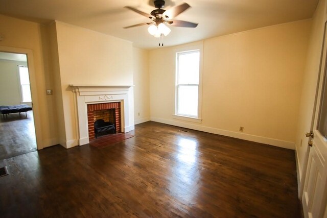 112 N Church St, Sparta, TN 38583 - unfurnished living room with a ceiling fan, a fireplace, dark wood-style flooring, and baseboards
