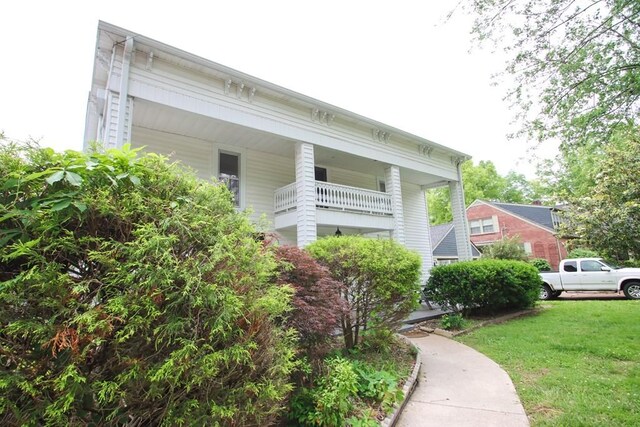 112 N Church St, Sparta, TN 38583 - view of home's exterior with a yard and covered porch