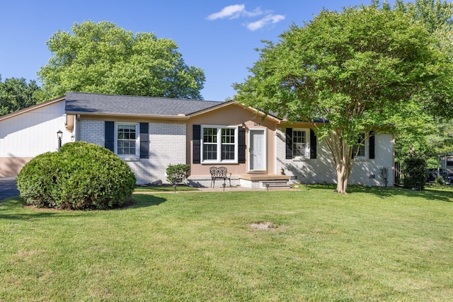 203 Hesta St, Spring Hill, TN 37174 - ranch-style home with a front yard and brick siding