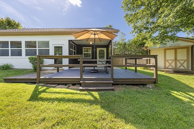 203 Hesta St, Spring Hill, TN 37174 - rear view of house featuring a deck, a lawn, and roof with shingles