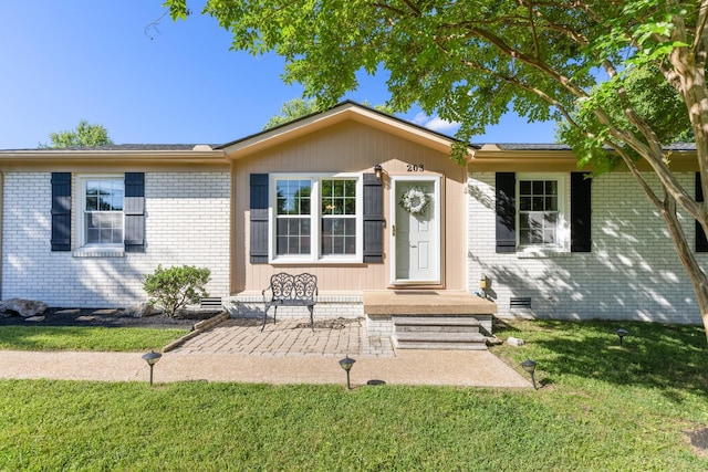 203 Hesta St, Spring Hill, TN 37174 - view of front of property with a front yard and brick siding