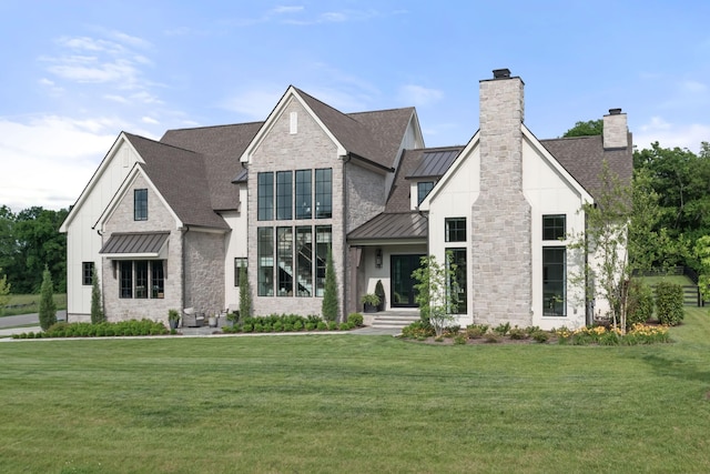 1936 Silver Fox Rd, Thompsons Station, TN 37179 - view of front of home featuring a standing seam roof, a chimney, a front lawn, and stone siding