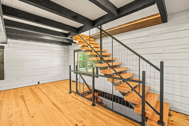 4221 New Hope Rd, Celina, TN 38551 - stairway with wood walls, beamed ceiling, and wood-type flooring
