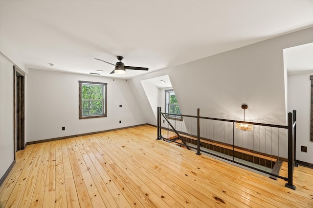 4221 New Hope Rd, Celina, TN 38551 - additional living space with hardwood / wood-style floors, ceiling fan, and baseboards