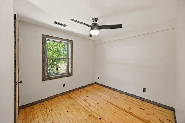 4221 New Hope Rd, Celina, TN 38551 - unfurnished room with baseboards, light wood-style floors, and ceiling fan