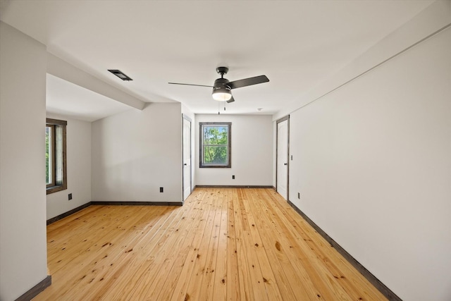 4221 New Hope Rd, Celina, TN 38551 - empty room featuring light wood-style flooring, ceiling fan, and baseboards