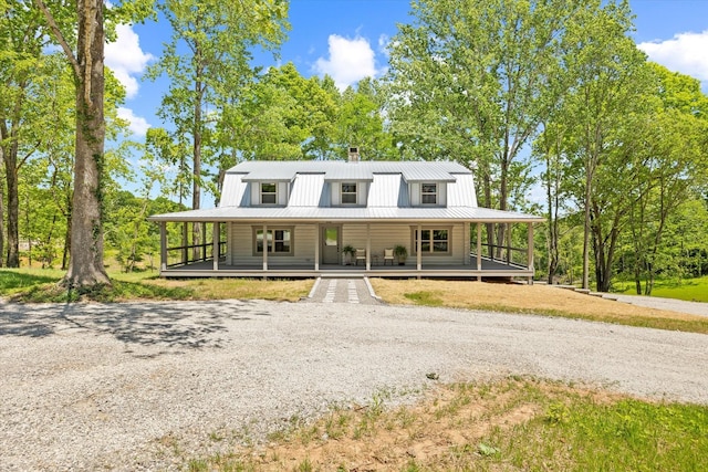 4221 New Hope Rd, Celina, TN 38551 - view of front of house featuring a porch, driveway, metal roof, and a chimney