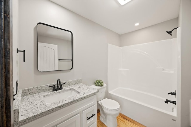 4221 New Hope Rd, Celina, TN 38551 - full bathroom featuring vanity, toilet, wood finished floors, and shower / washtub combination