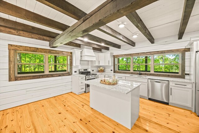 4221 New Hope Rd, Celina, TN 38551 - kitchen featuring stainless steel appliances, premium range hood, a sink, healthy amount of natural light, and wooden ceiling with exposed beams
