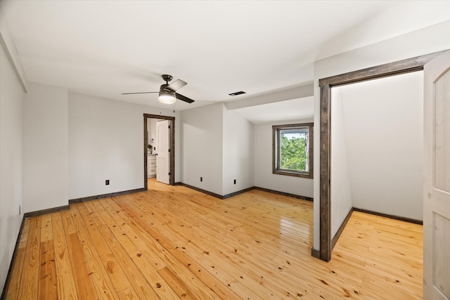 4221 New Hope Rd, Celina, TN 38551 - empty room featuring light wood-type flooring, baseboards, and a ceiling fan