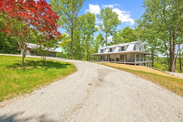 4221 New Hope Rd, Celina, TN 38551 - view of front of home featuring a gambrel roof, covered porch, and curved driveway