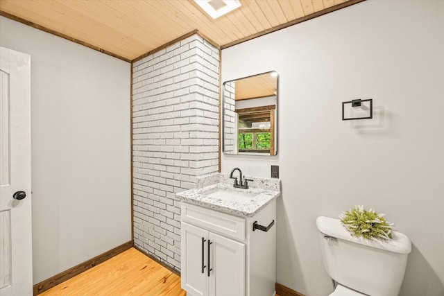4221 New Hope Rd, Celina, TN 38551 - half bath with vanity, wooden ceiling, toilet, wood finished floors, and baseboards