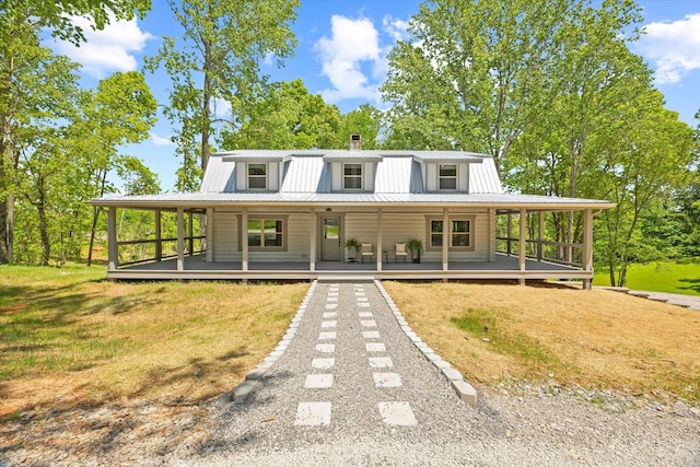 4221 New Hope Rd, Celina, TN 38551 - view of front of home with metal roof, a front yard, and covered porch