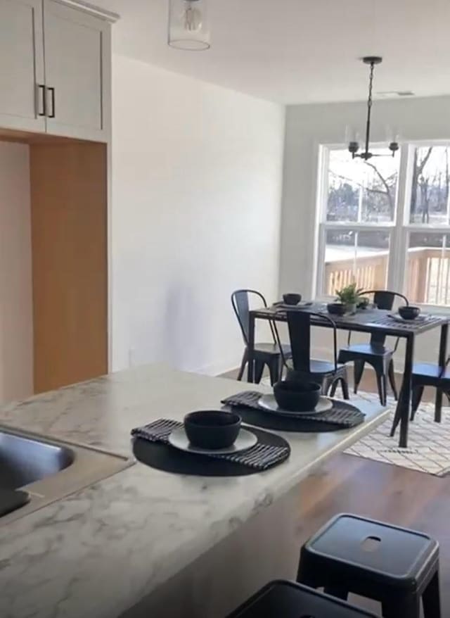 362 Baldwin Ln, Springfield, TN 37172 - dining area with wood finished floors and a chandelier