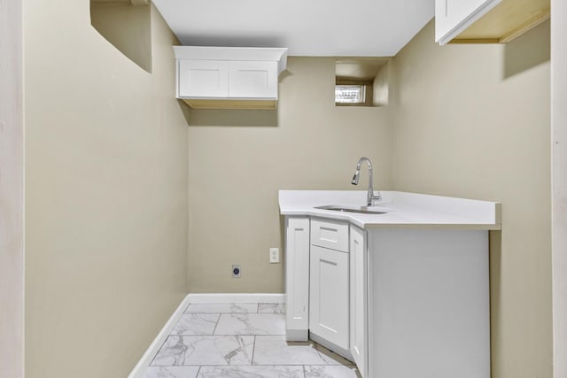 109 Garwood Dr, Nashville, TN 37210 - laundry area with a sink, light marble finish flooring, and baseboards