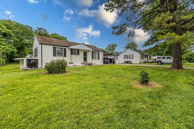 109 Garwood Dr, Nashville, TN 37210 - view of front of house with a front lawn and a carport